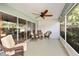 Versatile screened lanai featuring several seating options, ideal for entertaining at 16023 Sw 14Th Avenue Rd, Ocala, FL 34473