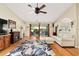 Inviting living room featuring hardwood floors, vaulted ceilings and a sliding glass door with access to an outdoor space at 16023 Sw 14Th Avenue Rd, Ocala, FL 34473