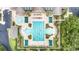 Aerial view of an outdoor community pool with lounge chairs and a beautiful landscaped deck area at 16023 Sw 14Th Avenue Rd, Ocala, FL 34473