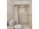 Neat bathroom featuring a shower, toilet, and tiled walls at 19620 Fox Trl, Dunnellon, FL 34432