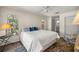 Bright bedroom features a large bed, closet, and a window offering natural light at 19620 Fox Trl, Dunnellon, FL 34432
