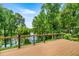 Expansive wood deck overlooking tranquil river scenery and lush trees at 19620 Fox Trl, Dunnellon, FL 34432