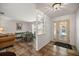 Bright entryway featuring decorative glass door and view into dining area at 19620 Fox Trl, Dunnellon, FL 34432