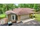 Aerial view of home's garage and the side entrance at 19620 Fox Trl, Dunnellon, FL 34432