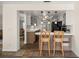Open kitchen featuring a breakfast bar overlooking the living area at 19620 Fox Trl, Dunnellon, FL 34432
