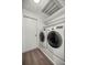 Bright laundry room with shelving and modern washer and dryer at 19620 Fox Trl, Dunnellon, FL 34432