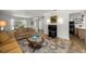 Inviting living room with comfortable seating and view of kitchen space at 19620 Fox Trl, Dunnellon, FL 34432