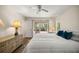 Cozy main bedroom with outdoor access, hardwood floors, and natural light at 19620 Fox Trl, Dunnellon, FL 34432