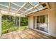 Spacious tiled patio with screen enclosure at 19620 Fox Trl, Dunnellon, FL 34432