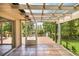 Covered patio with tile floor and view of the lake at 19620 Fox Trl, Dunnellon, FL 34432