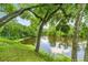 Calm river view with lush greenery framing the tranquil waterscape, perfect for relaxation at 19620 Fox Trl, Dunnellon, FL 34432