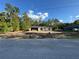 New construction home featuring concrete block walls and a concrete roof, set against a blue sky with white clouds at 19990 Sw 75Th St, Dunnellon, FL 34431