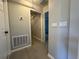 Hallway with wood look tile and doors leading to other rooms at 19990 Sw 75Th St, Dunnellon, FL 34431
