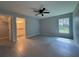 Main bedroom with gray tile flooring features a bathroom and walk-in closet at 19990 Sw 75Th St, Dunnellon, FL 34431