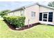 Charming home exterior featuring green lawn and trimmed hedges on a sunny day at 2100 Nw 50Th Cir, Ocala, FL 34482