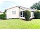 Charming home exterior featuring green lawn and trimmed hedges on a sunny day at 2100 Nw 50Th Cir, Ocala, FL 34482