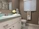Bathroom featuring white cabinets and a tile floor, and decorative towels at 2100 Nw 50Th Cir, Ocala, FL 34482