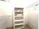 Walk in closet featuring white walls and shelves containing storage, including folded towels and quilts at 2100 Nw 50Th Cir, Ocala, FL 34482