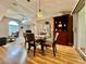 Dining room with a glass table and chairs adjacent to a built-in hutch and living space at 2100 Nw 50Th Cir, Ocala, FL 34482