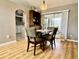 Bright dining area with sliding glass doors, a dark wood display cabinet, and stylish furniture at 2100 Nw 50Th Cir, Ocala, FL 34482