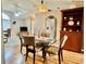 Inviting dining room boasts a glass table, stylish chairs, and a charming wooden display cabinet at 2100 Nw 50Th Cir, Ocala, FL 34482