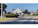 Community entrance with a charming gatehouse, showcasing a secure and welcoming neighborhood at 2100 Nw 50Th Cir, Ocala, FL 34482