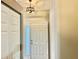 Bright entryway featuring a closet and decorative light fixture above the door at 2100 Nw 50Th Cir, Ocala, FL 34482