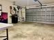 Large, empty garage, featuring ample open space with a workbench, and room for storage or vehicles at 2100 Nw 50Th Cir, Ocala, FL 34482
