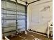 Garage interior with a partial view of the door, showing the space and a few stacked chairs at 2100 Nw 50Th Cir, Ocala, FL 34482