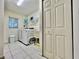 Bright laundry room with modern appliances, sink, and ample storage at 2100 Nw 50Th Cir, Ocala, FL 34482