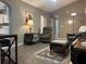 Cozy living room with neutral walls, comfortable seating, and accent rug on tile flooring at 2100 Nw 50Th Cir, Ocala, FL 34482