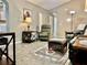Inviting living room featuring plush seating, decorative rug, and arched doorways to other rooms at 2100 Nw 50Th Cir, Ocala, FL 34482