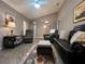 Open concept living room with comfortable seating, vaulted ceilings, and a decorative rug at 2100 Nw 50Th Cir, Ocala, FL 34482