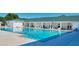 Large community pool with rows of lounge chairs under a covered area for residents to enjoy at 2100 Nw 50Th Cir, Ocala, FL 34482