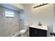 Modern bathroom with walk-in shower, marble tile surround, and sleek vanity at 21111 Sw Honeysuckle St, Dunnellon, FL 34431