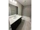 Bright bathroom featuring a vanity with white marble countertops, a shower and a bathtub at 2350 Sw 150Th Ct, Ocala, FL 34481