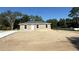 Charming single-story home with a well-maintained lawn and a paved driveway at 2350 Sw 150Th Ct, Ocala, FL 34481