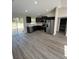 Modern kitchen with stainless steel appliances and sleek countertops, and views to the outside at 2350 Sw 150Th Ct, Ocala, FL 34481