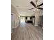 Open-concept living area featuring hardwood floors and sliding glass doors to the backyard at 2350 Sw 150Th Ct, Ocala, FL 34481