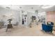 Open-concept living space with stylish decor, featuring hardwood floors and ample natural light at 2418 Se 22Nd Pl, Ocala, FL 34471