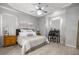 Spacious main bedroom featuring tray ceilings, wood floors and elegant décor at 2418 Se 22Nd Pl, Ocala, FL 34471