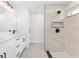 Well-designed bathroom showcasing a double vanity, modern fixtures, and a glass-enclosed walk-in shower at 26 Water Track Dr, Ocala, FL 34472