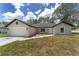 Delightful single-story home with attached garage and freshly landscaped front yard at 26 Water Track Dr, Ocala, FL 34472