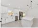 Beautiful kitchen with stainless steel appliances, white cabinets, quartz countertops, and a central island at 26 Water Track Dr, Ocala, FL 34472
