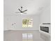 Bright living room with large windows, sleek fireplace, and ample natural light creating an inviting space at 26 Water Track Dr, Ocala, FL 34472