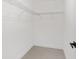 Walk-in closet showing a metal shelving system and neutral walls at 26 Water Track Dr, Ocala, FL 34472