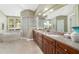 Luxurious bathroom featuring a garden tub, walk-in shower, dual sink vanity, and bright window at 2908 Se 22Nd Ave, Ocala, FL 34471