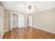 Bedroom featuring wood floors, a closet and entry doors for easy access at 2908 Se 22Nd Ave, Ocala, FL 34471