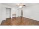 Bright bedroom features wood floors, a ceiling fan and closet for organized storage solutions at 2908 Se 22Nd Ave, Ocala, FL 34471
