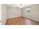 Bedroom with wood floors and natural light from the window overlooking the exterior at 2908 Se 22Nd Ave, Ocala, FL 34471